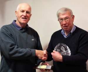 Anthony McGonigle being presented the Silva Trophy by Noel Bogle